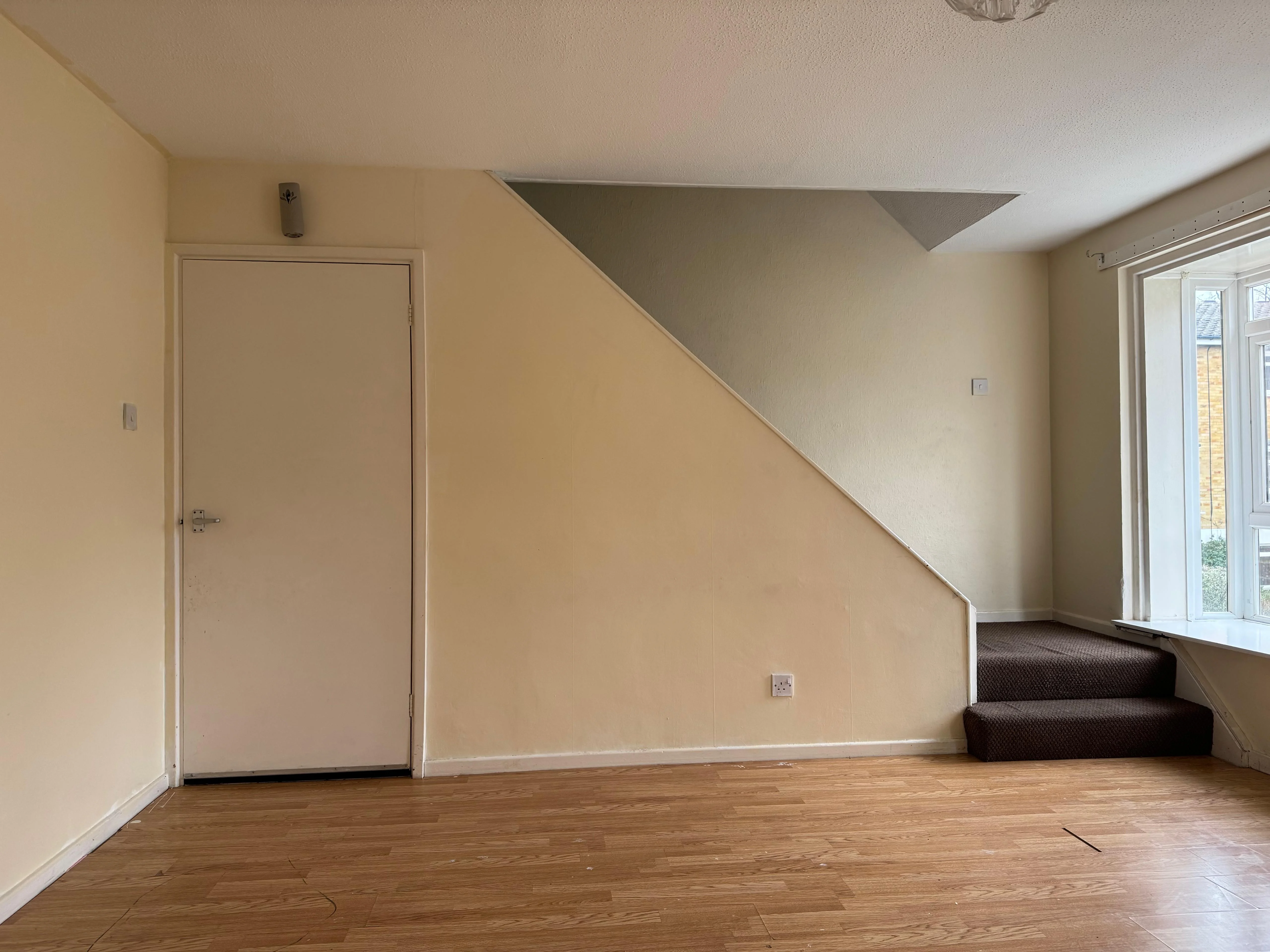 Living room and stairs, before