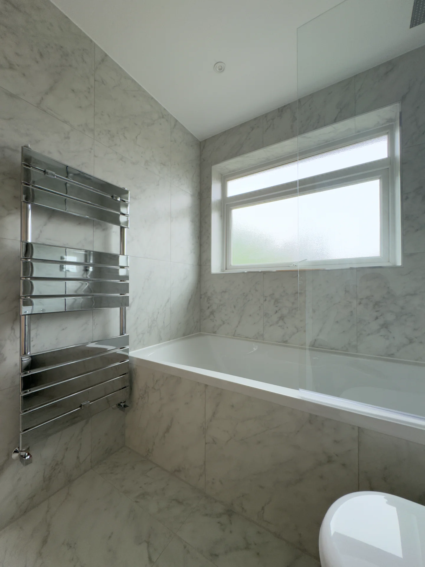 Towel radiator and bath, after