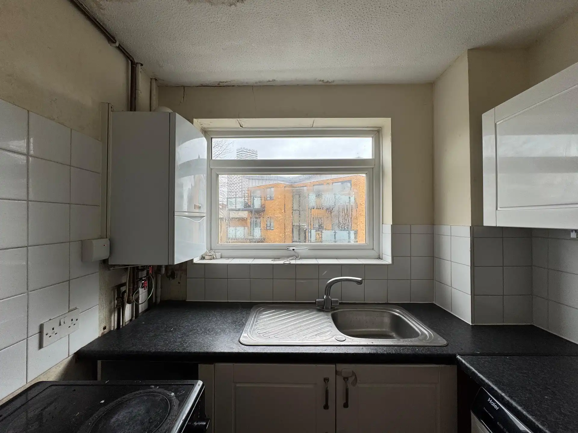 Kitchen sink and window, before