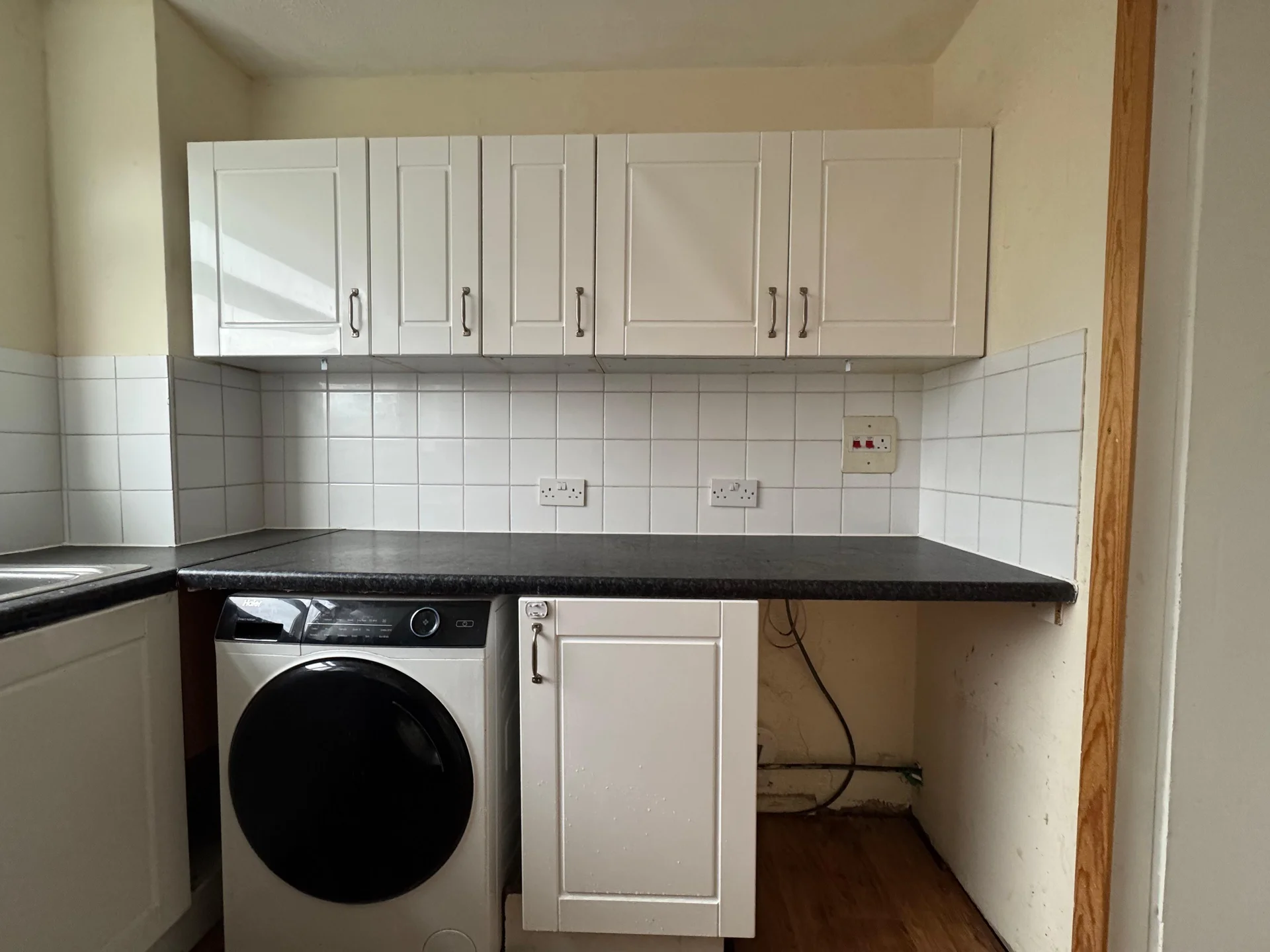 Kitchen units and washing machine, before