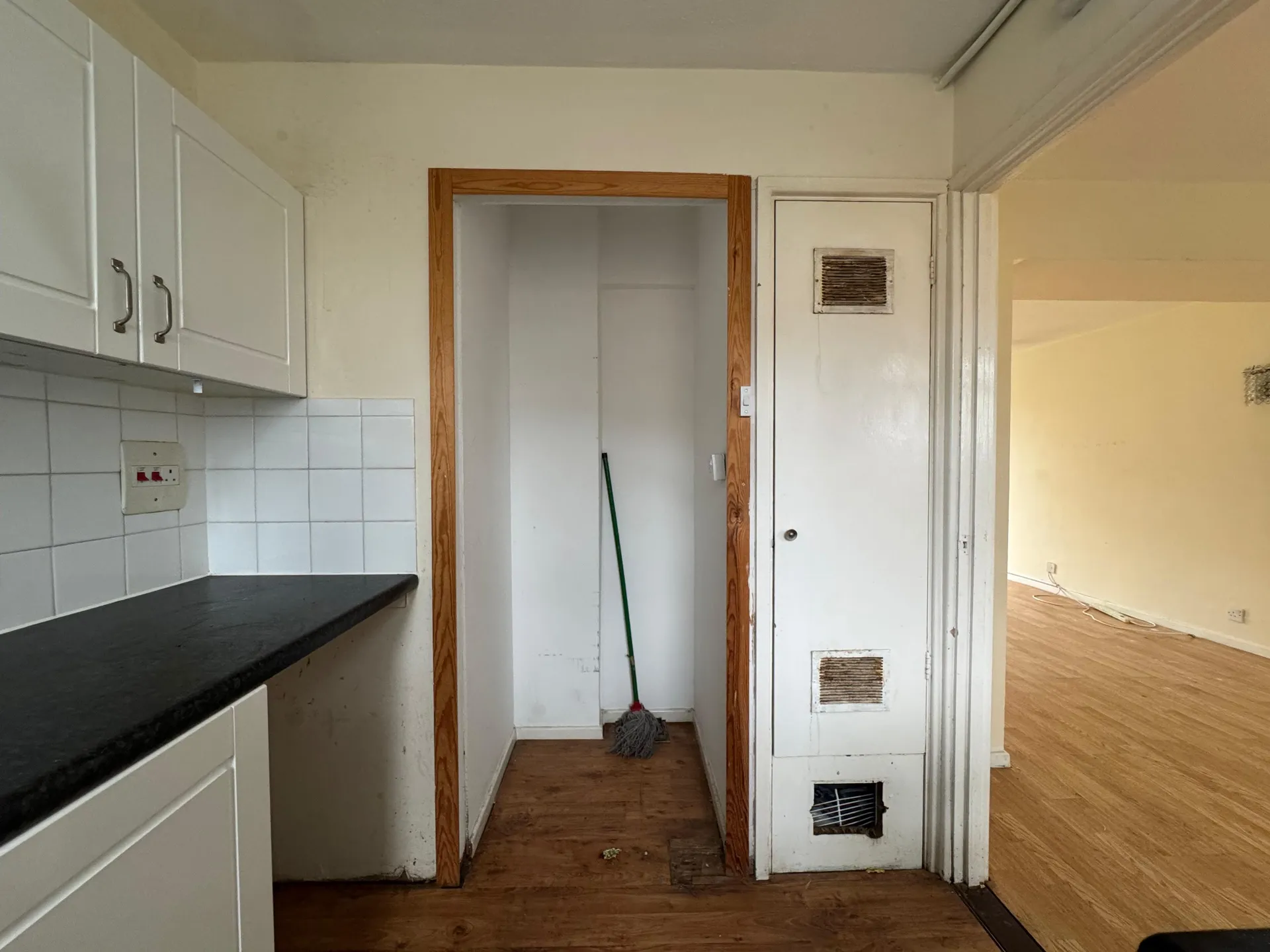 Kitchen storage and boiler cupboard, before